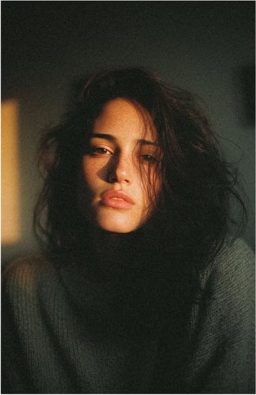 Portrait in low light, direct gaze